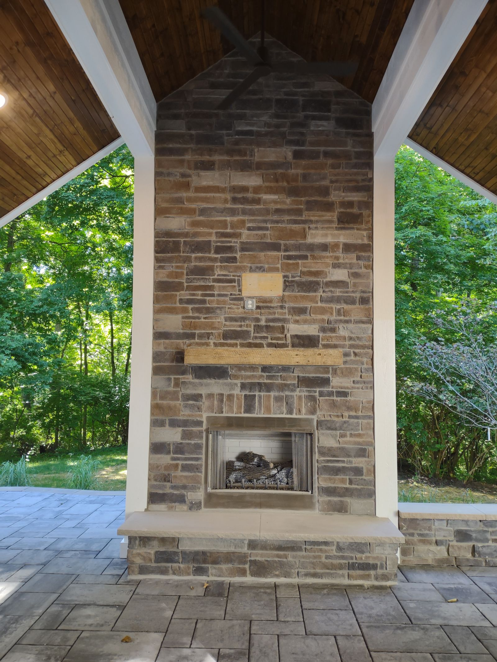 Brick chimney rising through the gable porch roof